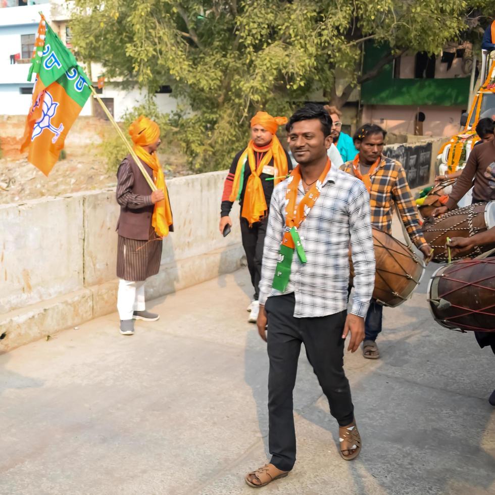 Delhi, India, December 02 2022 -Bharatiya Janata Party BJP supporter during mega road show in support of BJP candidate Pankaj Luthara to file nomination papers ahead of MCD local body Elections 2022 photo
