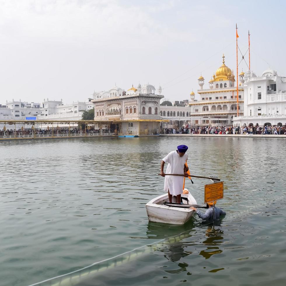 Amritsar, India - February 26 2023 - Unidentified devotees from various parts at Golden Temple Harmandir Sahib in Amritsar, Punjab, India, Famous indian sikh landmark, Golden Temple photo