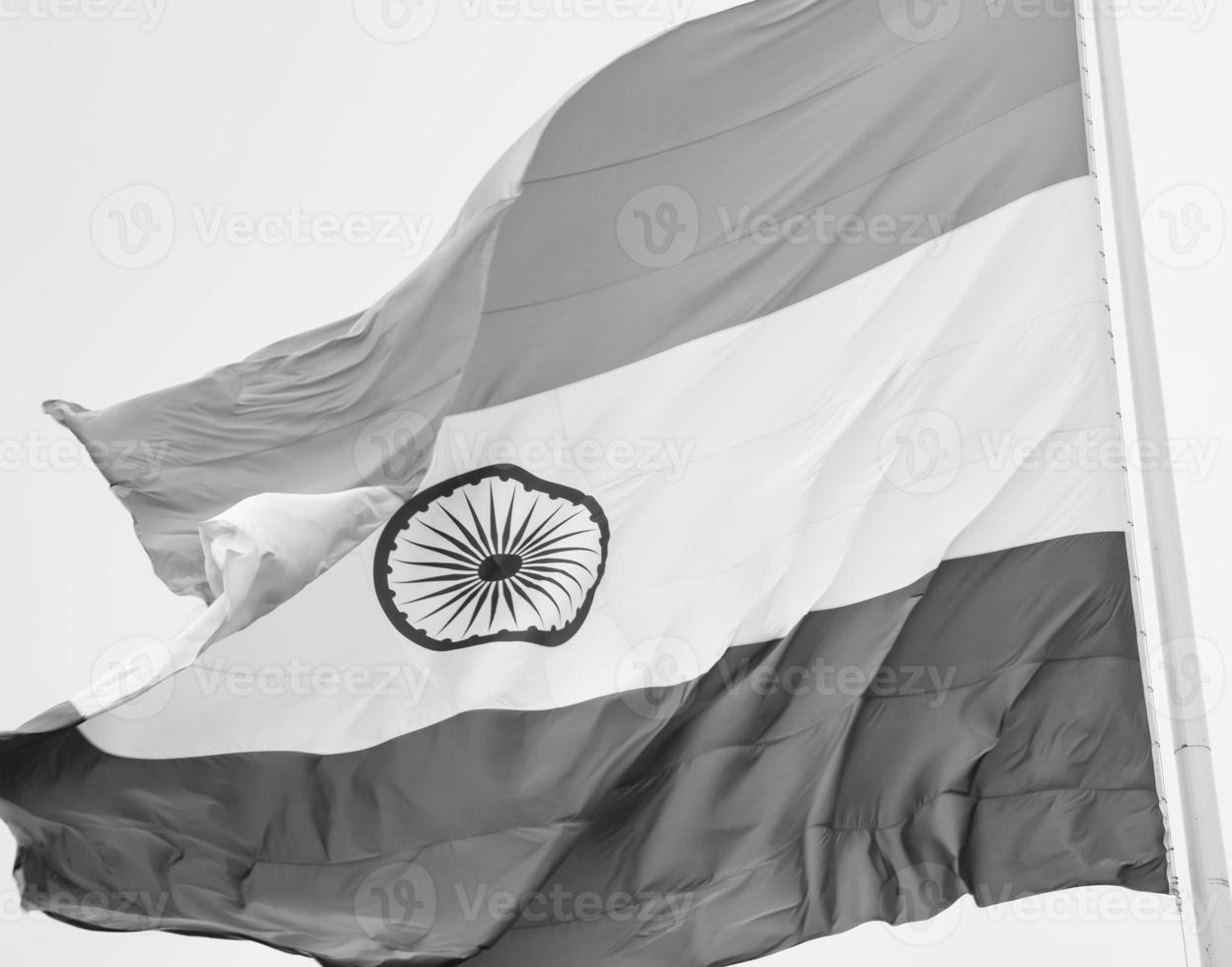 India flag flying high at Connaught Place with pride in blue sky, India flag fluttering, Indian Flag on Independence Day and Republic Day of India, tilt up shot, Waving Indian flag, Har Ghar Tiranga photo