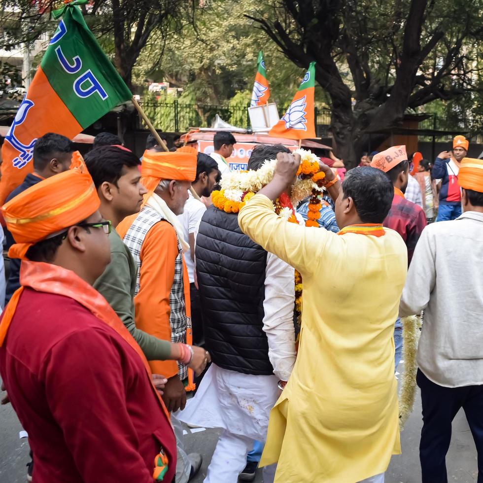 Delhi, India, December 02 2022 -Bharatiya Janata Party - BJP supporter during mega road show in support of BJP candidate Pankaj Luthara to file nomination papers ahead of MCD local body Elections 2022 photo