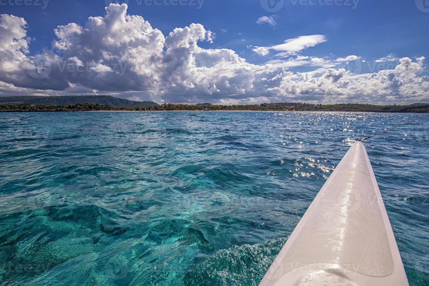 Beautiful landscape from the catamaran to Atlantic ocean and coastline, Turquoise water and blue sky with clouds. Cuba photo