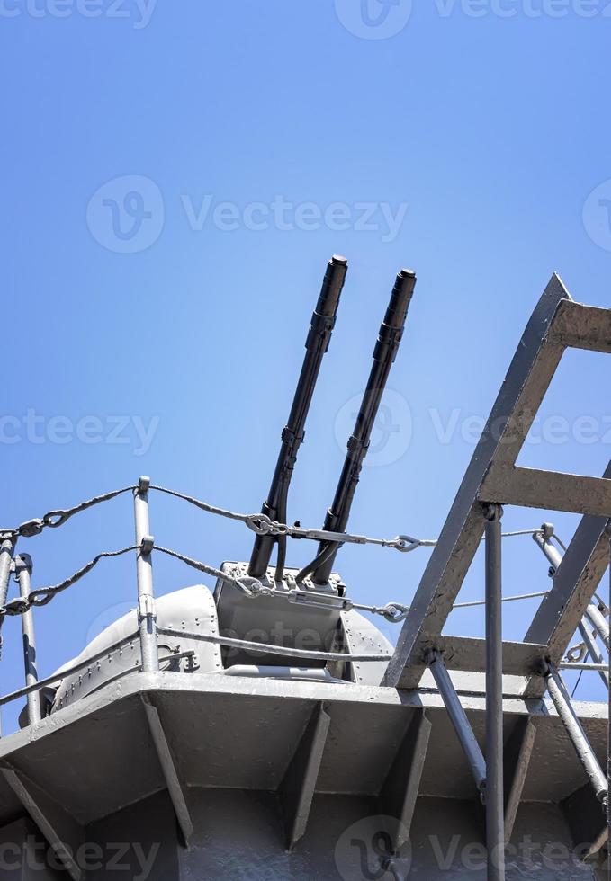 Close-up of a tower with a ship gun. Ship weapon tower. Naval exercises, attack, and defense. photo