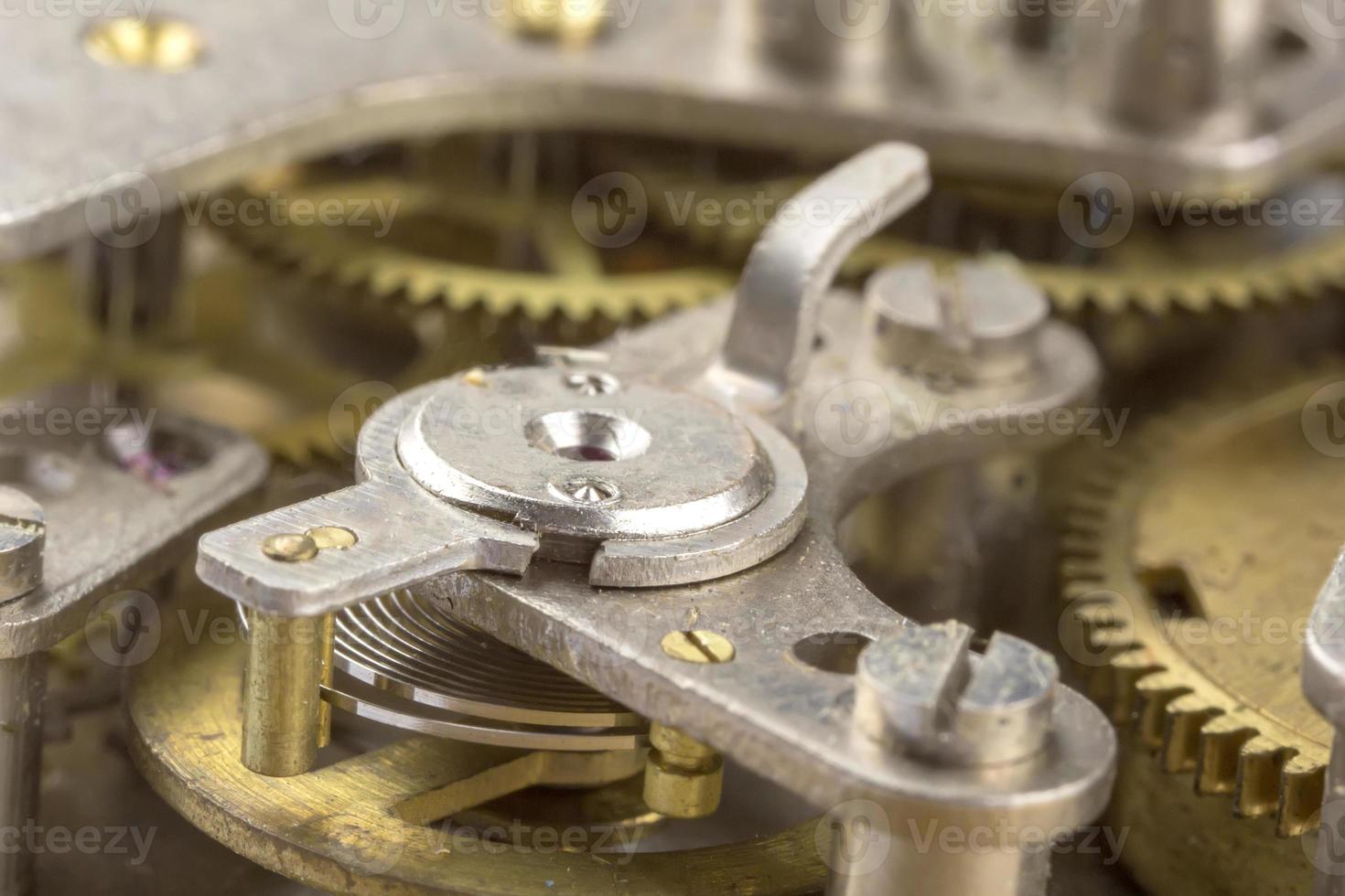 Macro shot of clockwork gears inside the old watch photo
