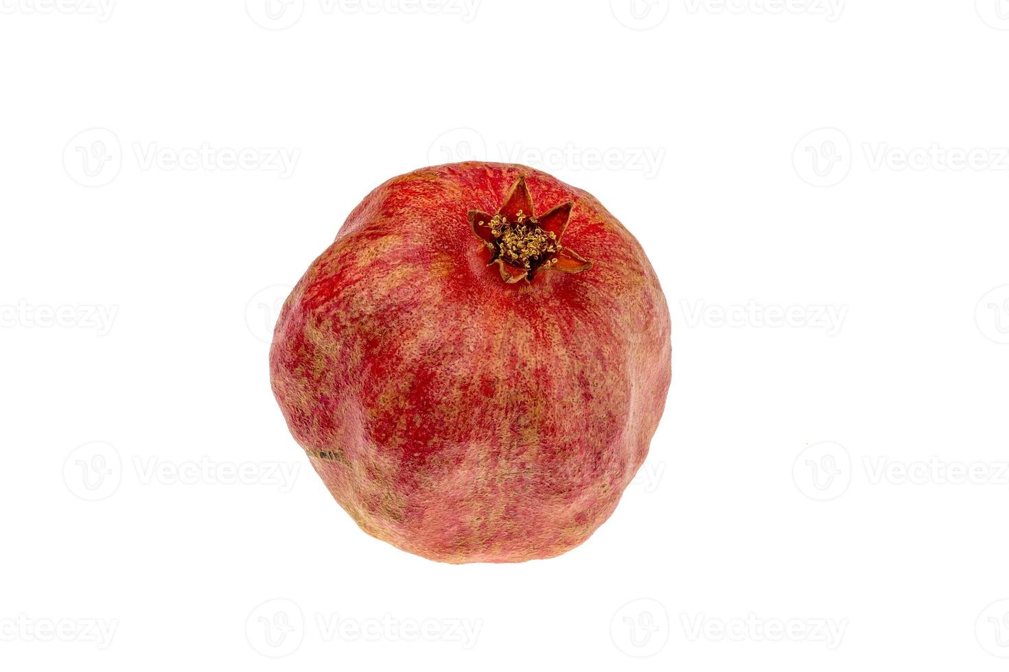 Red pomegranate isolated on white background. Sweet and juicy garnet photo