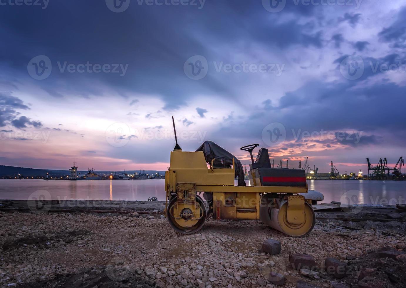 Amazing view at small roller at a construction site in a beautiful twilight photo