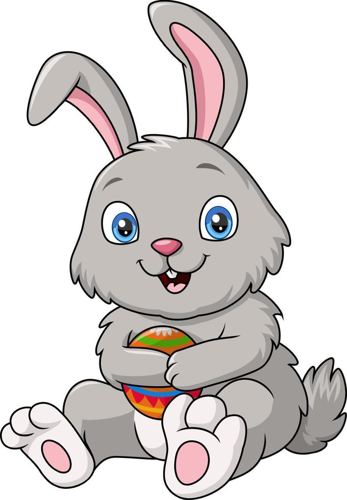 Cute rabbit cartoon holding an easter eggs vector