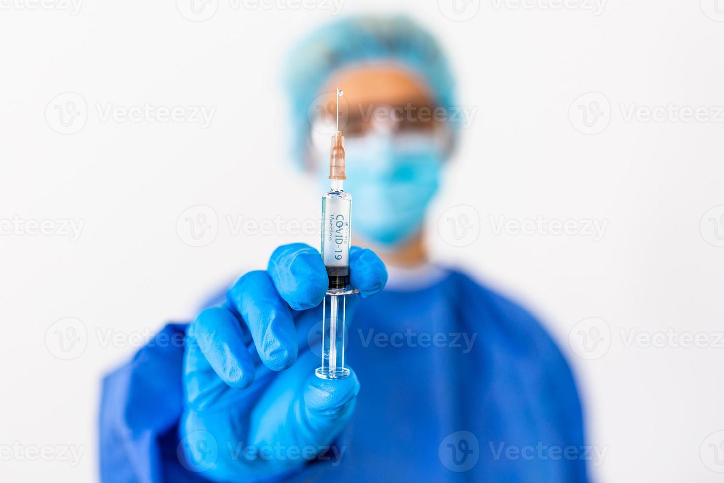 Development and creation of a coronavirus vaccine COVID-19 .Coronavirus Vaccine concept in hand of doctor blue vaccine jar. Vaccine Concept of fight against coronavirus. photo