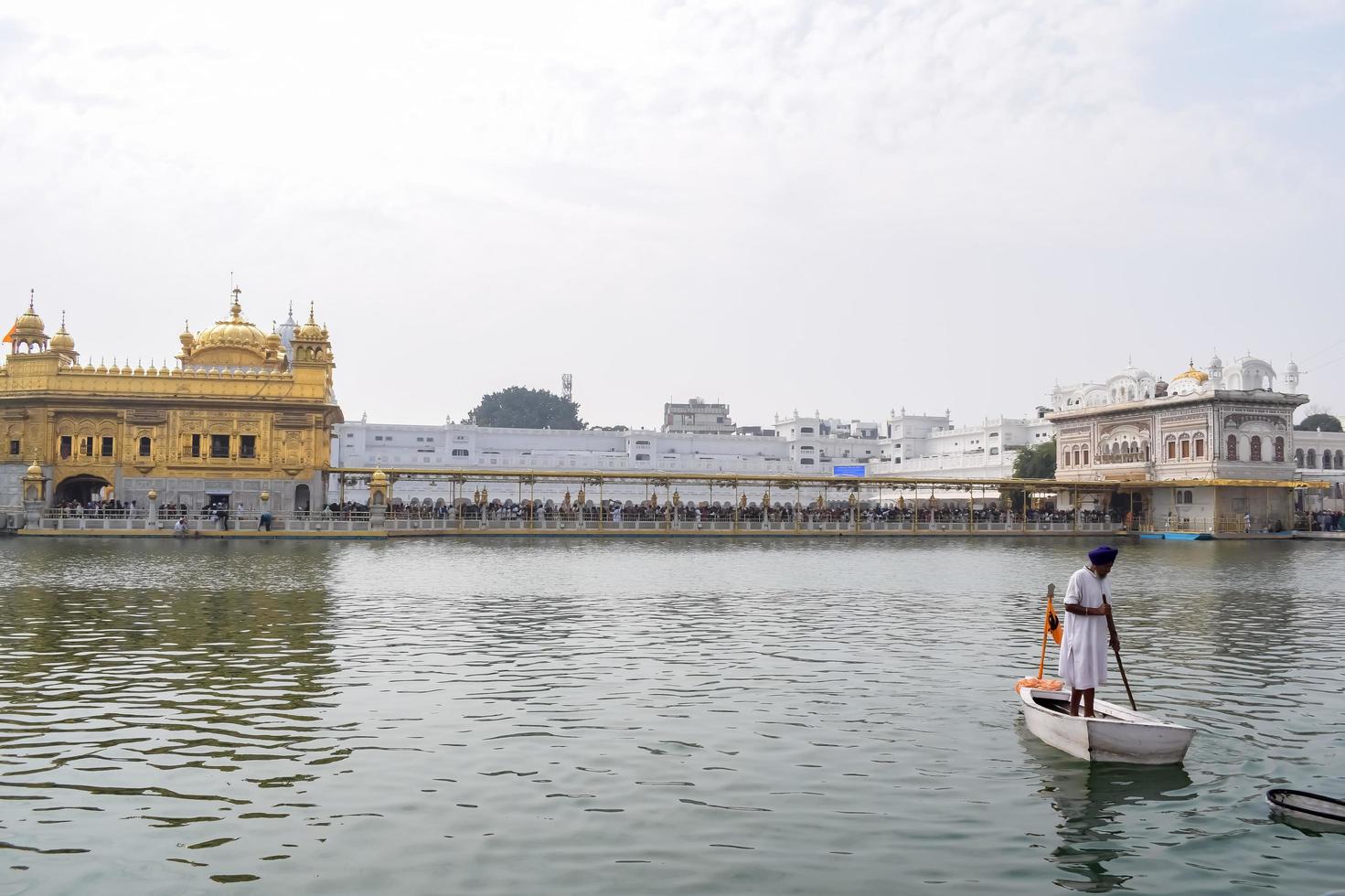 Amritsar, India - February 26 2023 - Unidentified devotees from various parts at Golden Temple Harmandir Sahib in Amritsar, Punjab, India, Famous indian sikh landmark, Golden Temple photo