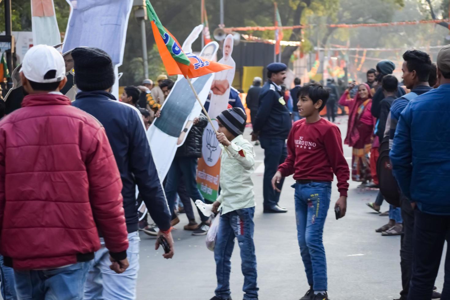 New Delhi, India - January 16 2023 - Thousands of people collected during Prime Minister Narendra Modi BJP road show, people during PM Modi big election rally in the capital photo