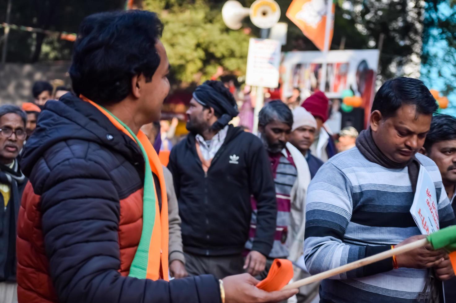 New Delhi, India - January 16 2023 - Thousands of people collected during Prime Minister Narendra Modi BJP road show, people during PM Modi big election rally in the capital photo