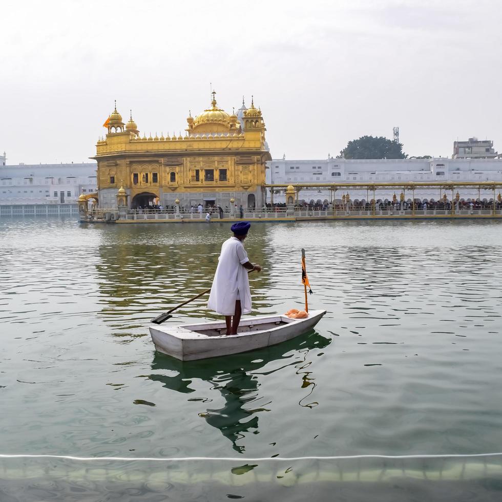 Amritsar, India - February 26 2023 - Unidentified devotees from various parts at Golden Temple Harmandir Sahib in Amritsar, Punjab, India, Famous indian sikh landmark, Golden Temple photo