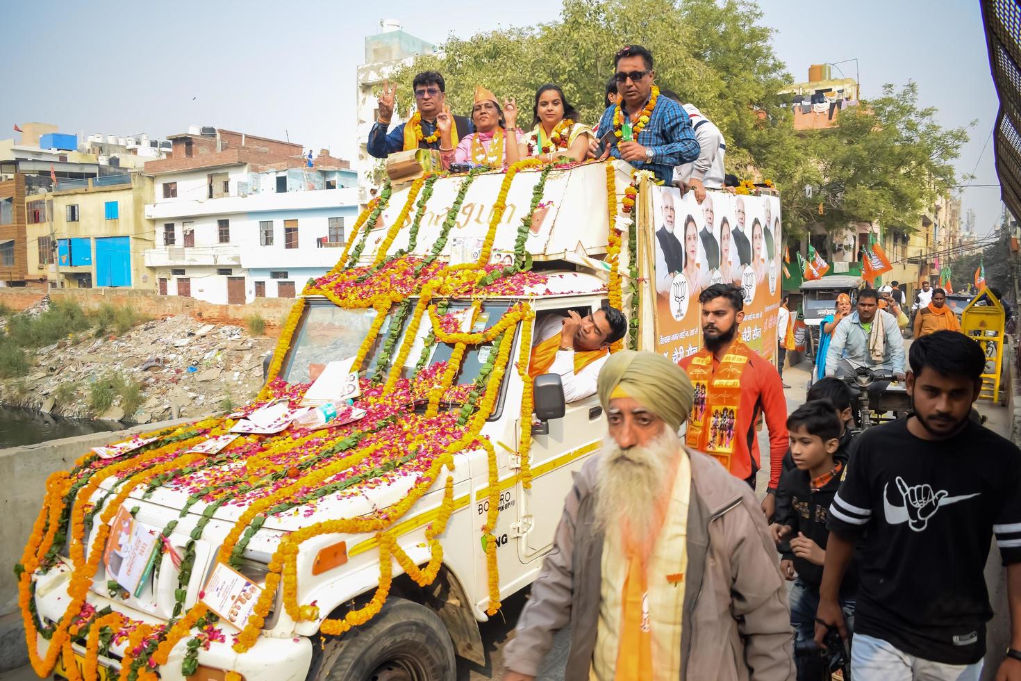 Delhi, India, December 02 2022 -Bharatiya Janata Party BJP supporter during mega road show in support of BJP candidate Pankaj Luthara to file nomination papers ahead of MCD local body Elections 2022 photo