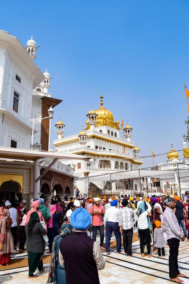 Amritsar, India - February 26 2023 - Unidentified devotees from various parts at Golden Temple - Harmandir Sahib in Amritsar, Punjab, India, Famous indian sikh landmark, Golden Temple photo