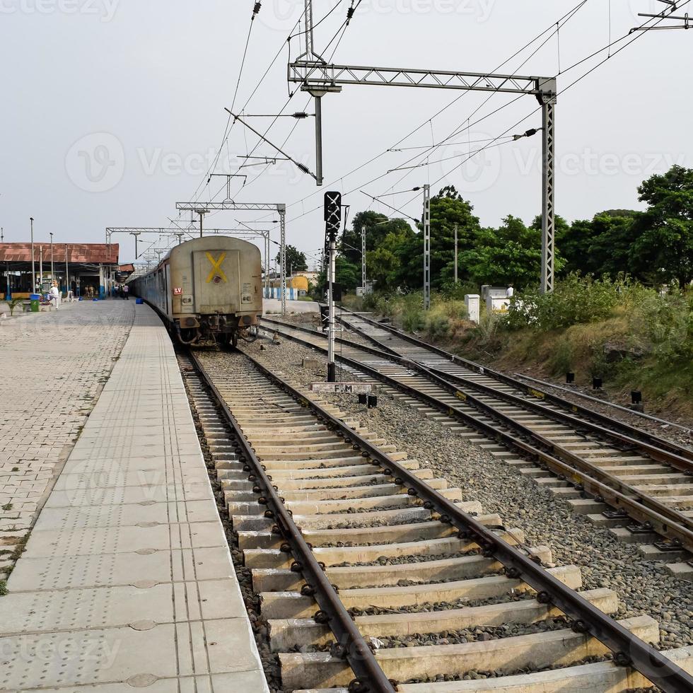 View of Toy train Railway Tracks from the middle during daytime near Kalka railway station in India, Toy train track view, Indian Railway junction, Heavy industry photo