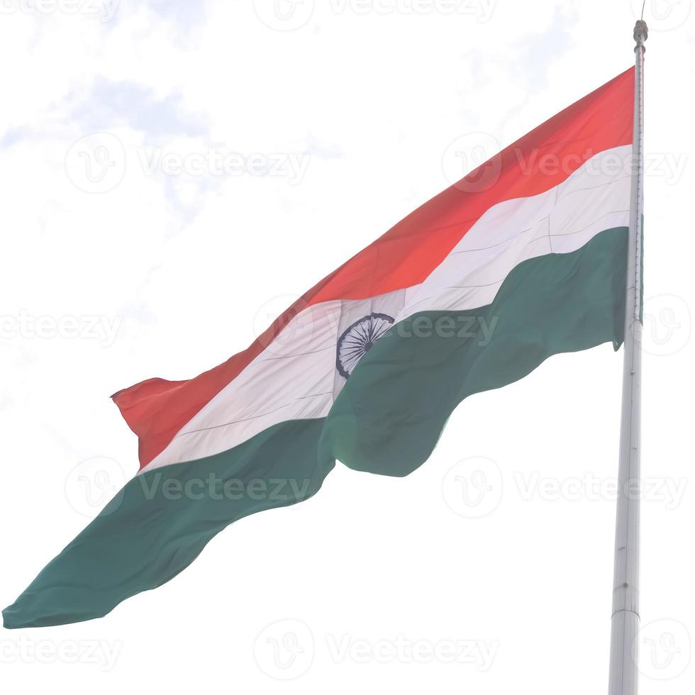 India flag flying high at Connaught Place with pride in blue sky, India flag fluttering, Indian Flag on Independence Day and Republic Day of India, tilt up shot, Waving Indian flag, Har Ghar Tiranga photo