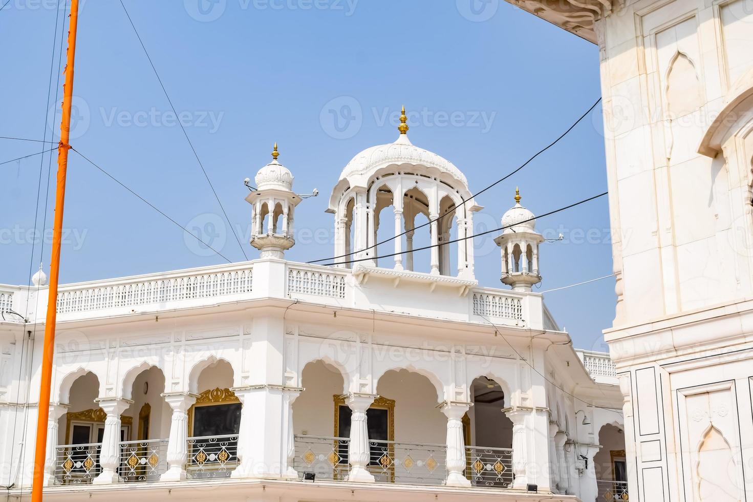 View of details of architecture inside Golden Temple Harmandir Sahib in Amritsar, Punjab, India, Famous indian sikh landmark, Golden Temple, the main sanctuary of Sikhs in Amritsar, India photo