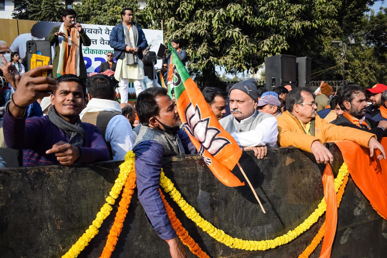 New Delhi, India - January 16 2023 - Thousands of people collected during Prime Minister Narendra Modi BJP road show, people during PM Modi big election rally in the capital photo