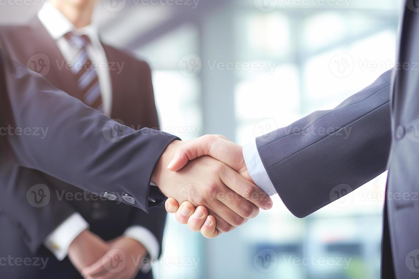 Businessman shaking hands after signing off on a meeting with partners, setting goals, and planning the way to success. Collaborative teamwork photo