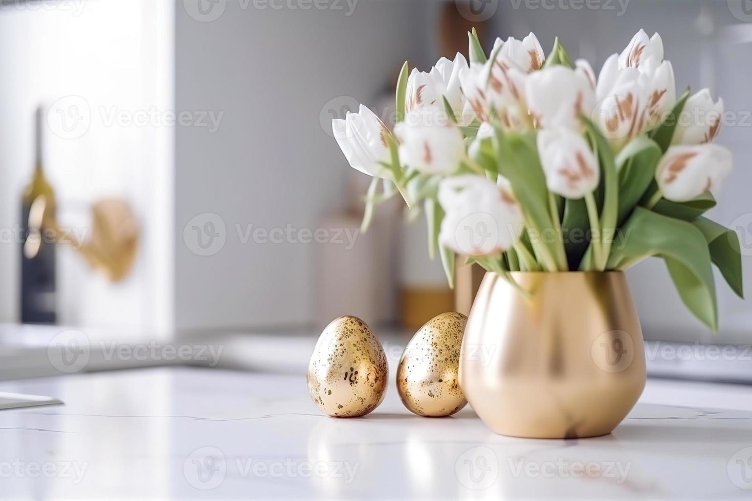 Easter table setting with tulips, Easter bunnies, and eggs with golden patterns in the white Scandinavian-style kitchen background. Beautiful minimalist design for greeting card photo