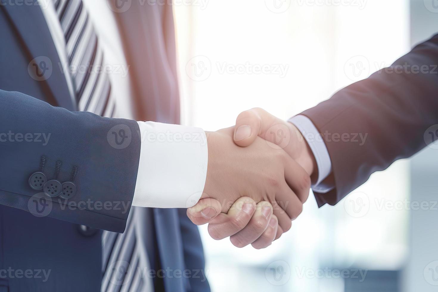 Businessman shaking hands after signing off on a meeting with partners, setting goals, and planning the way to success. Collaborative teamwork photo