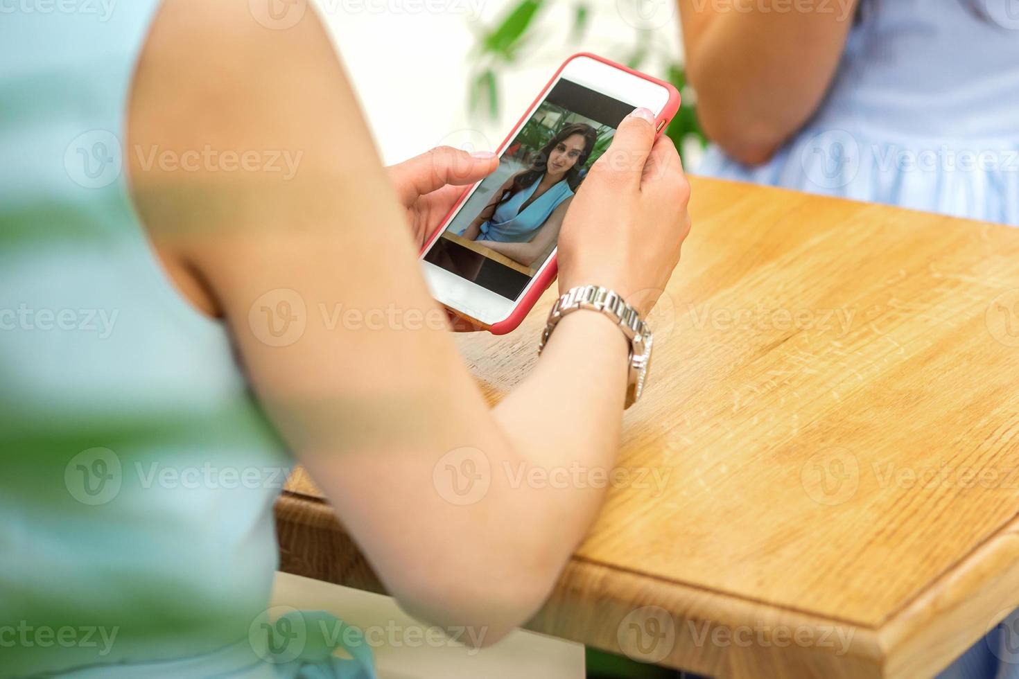 Woman looking at photos on phone