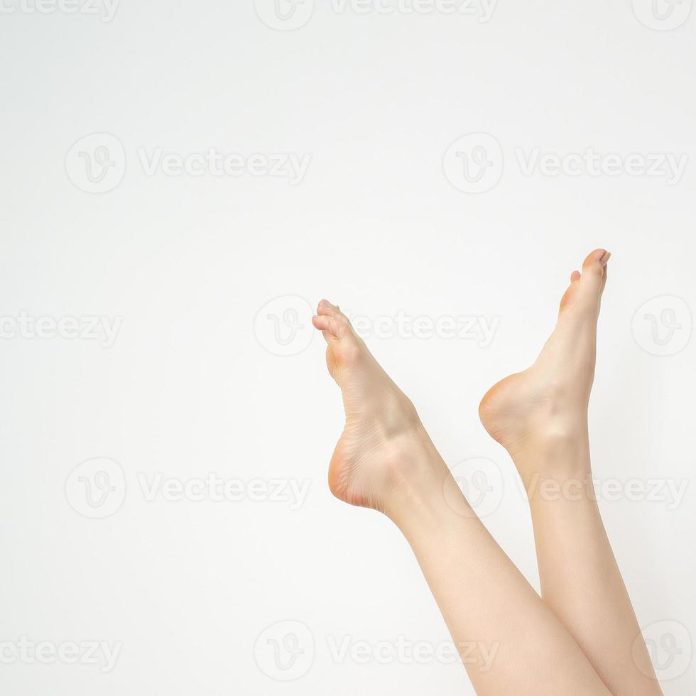 Female beautiful slender white feet photo