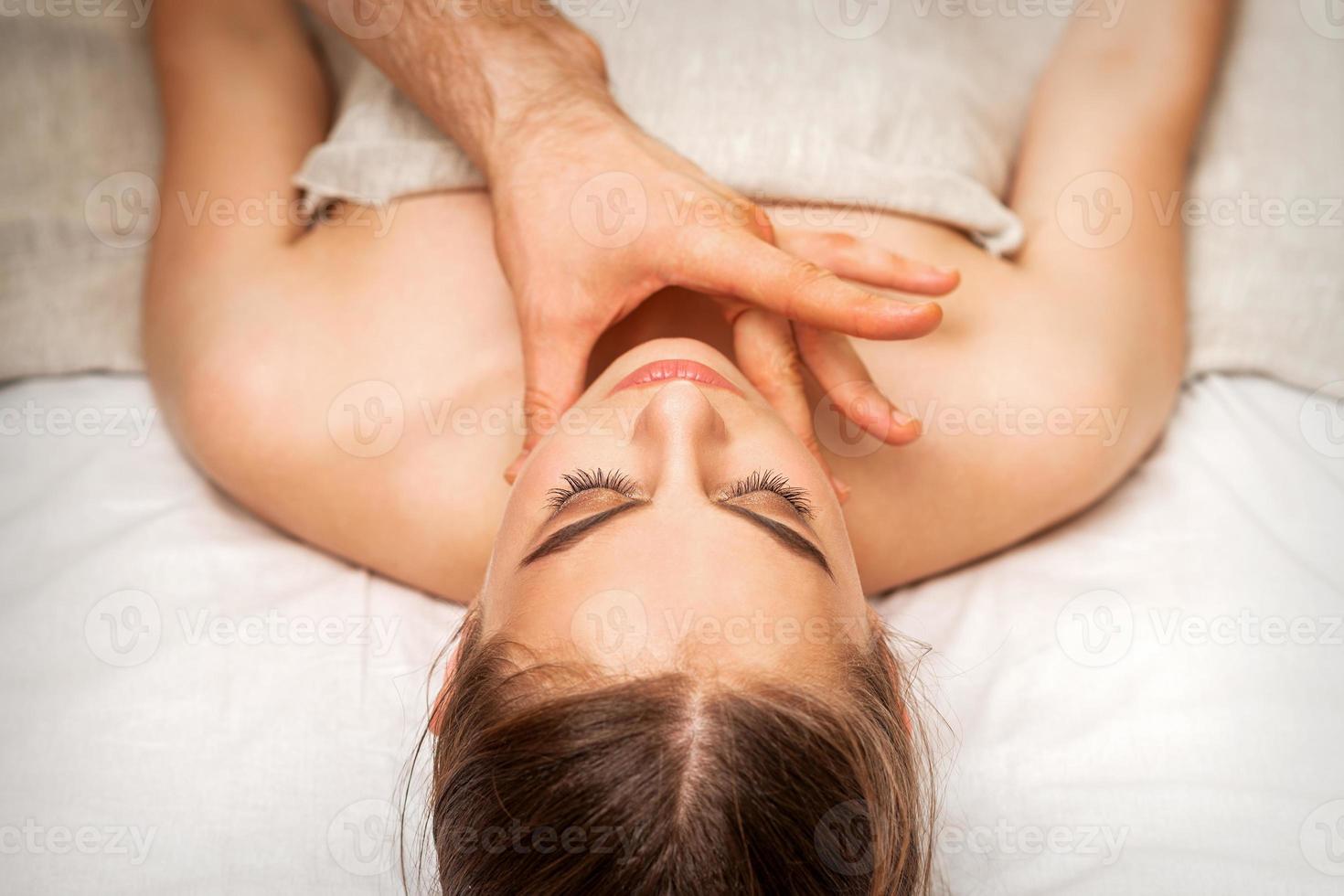 Chin or neck massage of woman photo