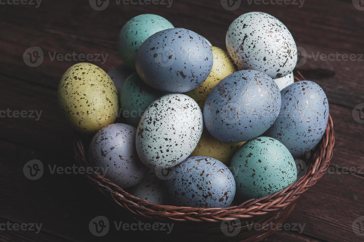 Pastel Easter eggs background. Spring greating card. Easter eggs in basket photo