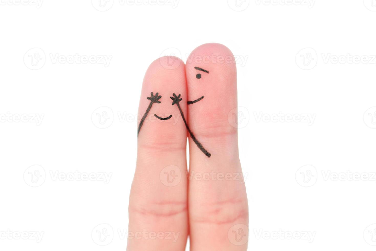 Fingers art of Happy couple. Boy closed her eyes to girl. Concept of girl guessed who closed his eyes. photo