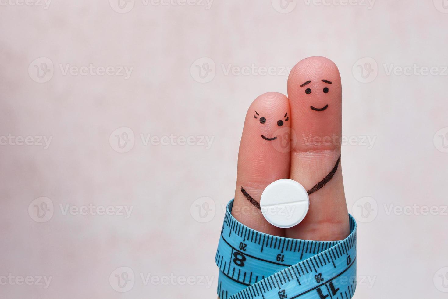 Fingers art of Happy couple. The concept of a man and a woman on the pill for weight loss. photo