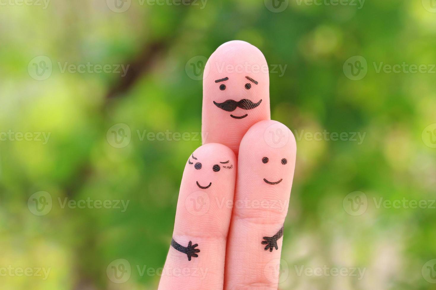 Fingers art of happy family. Concept father hugs children. photo