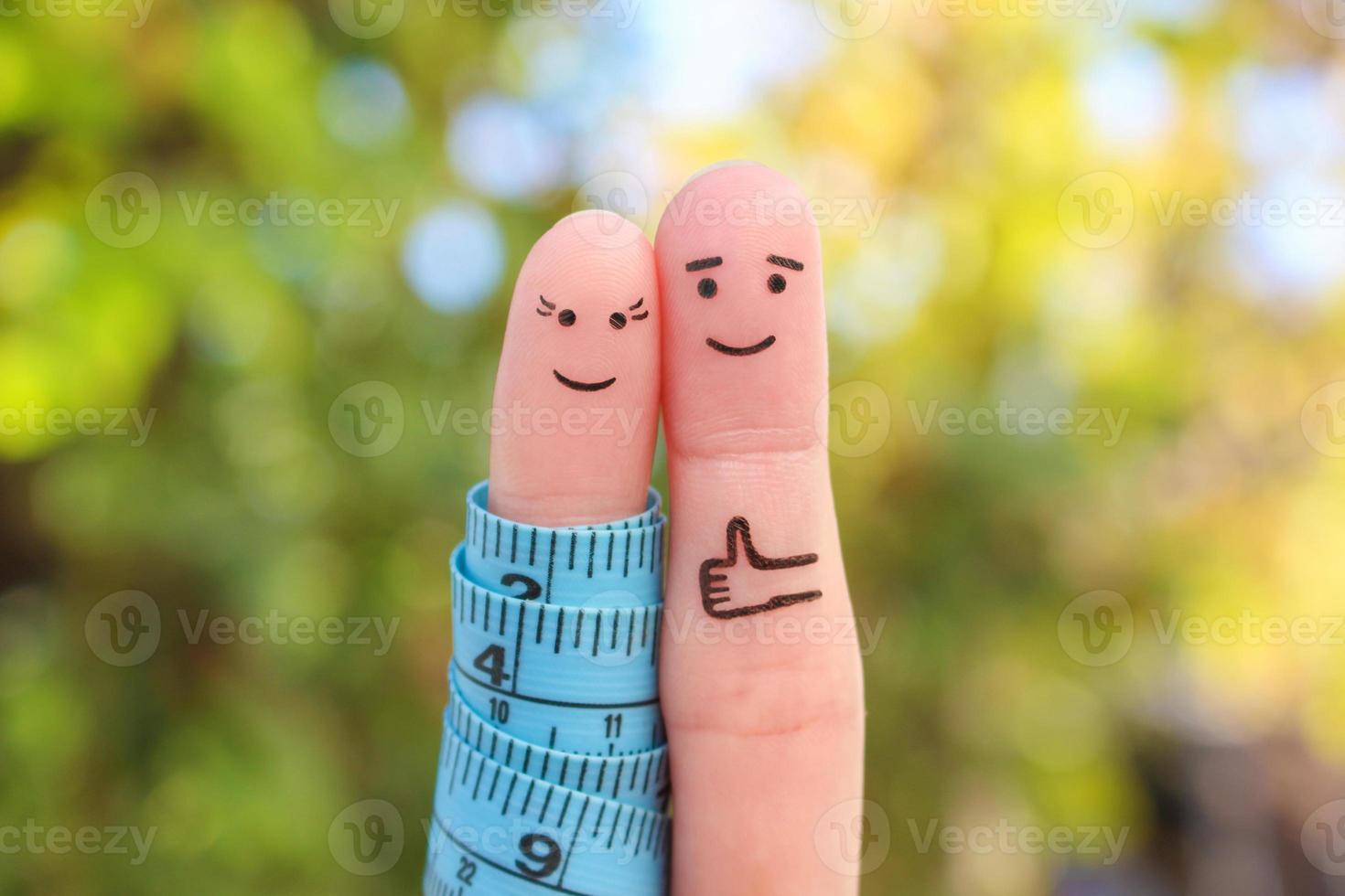 Fingers art of a Happy couple with tape measure. Concept of losing weight together. photo