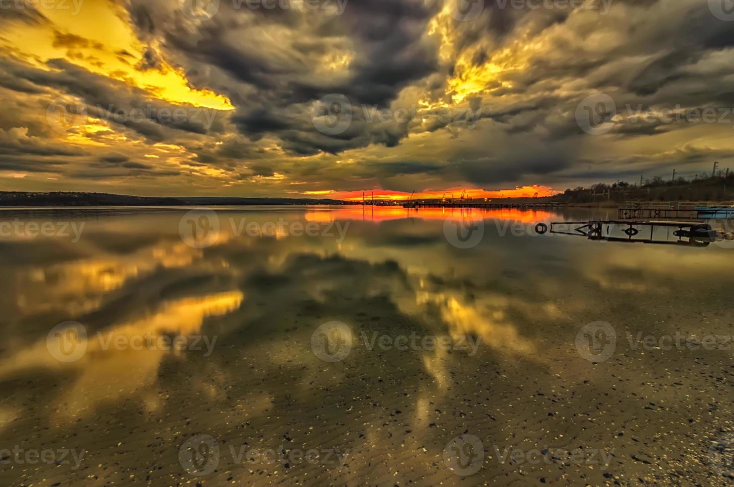 Stunning long exposure clouds with transparent water reflection photo