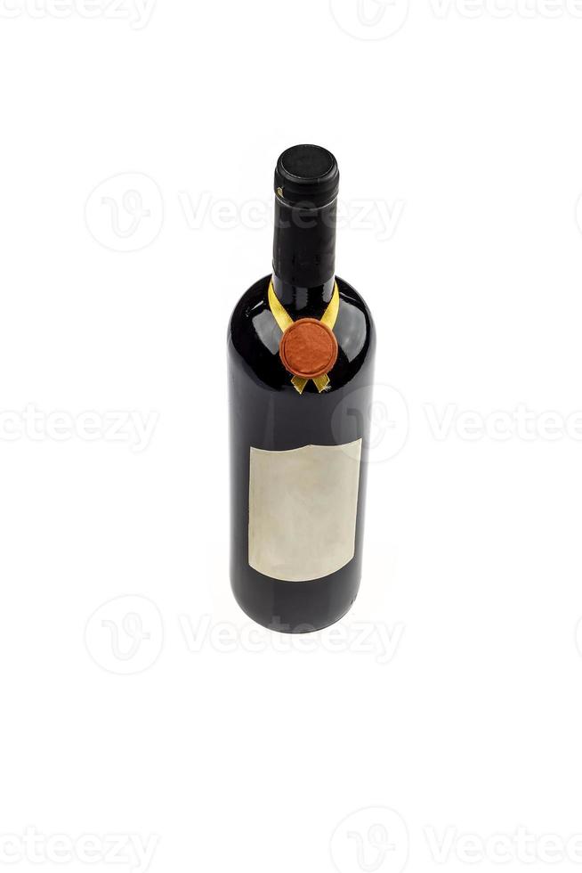 above view of red wine bottle isolated on white background photo