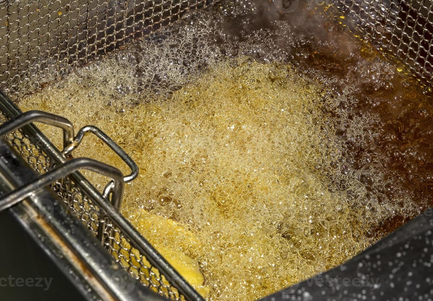 fryer for potatoes with fries with boiling oil. Concept fast food restaurant,  kitchen equipment photo