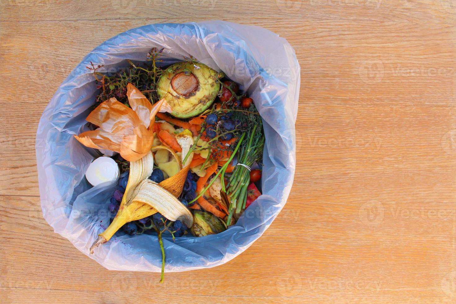 Domestic waste for compost from fruits and vegetables in garbage bin. photo