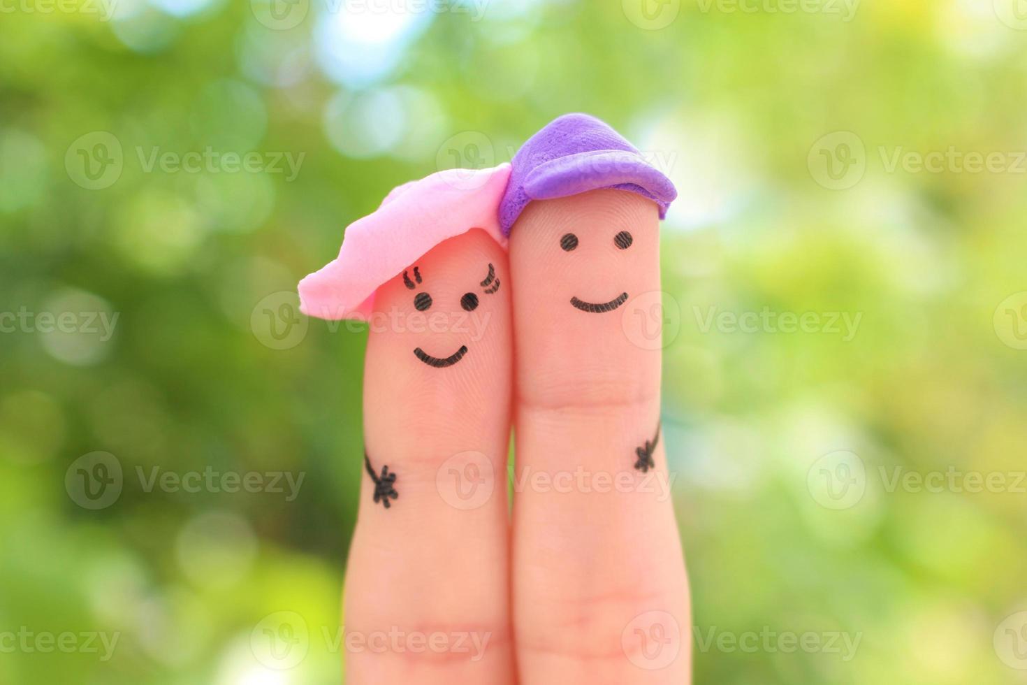 Fingers art of happy couple on vacation. photo