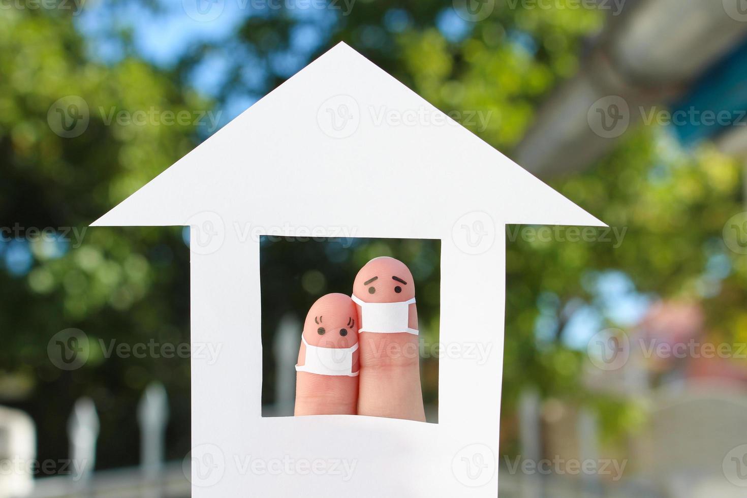 Fingers art of couple with face mask at home. photo