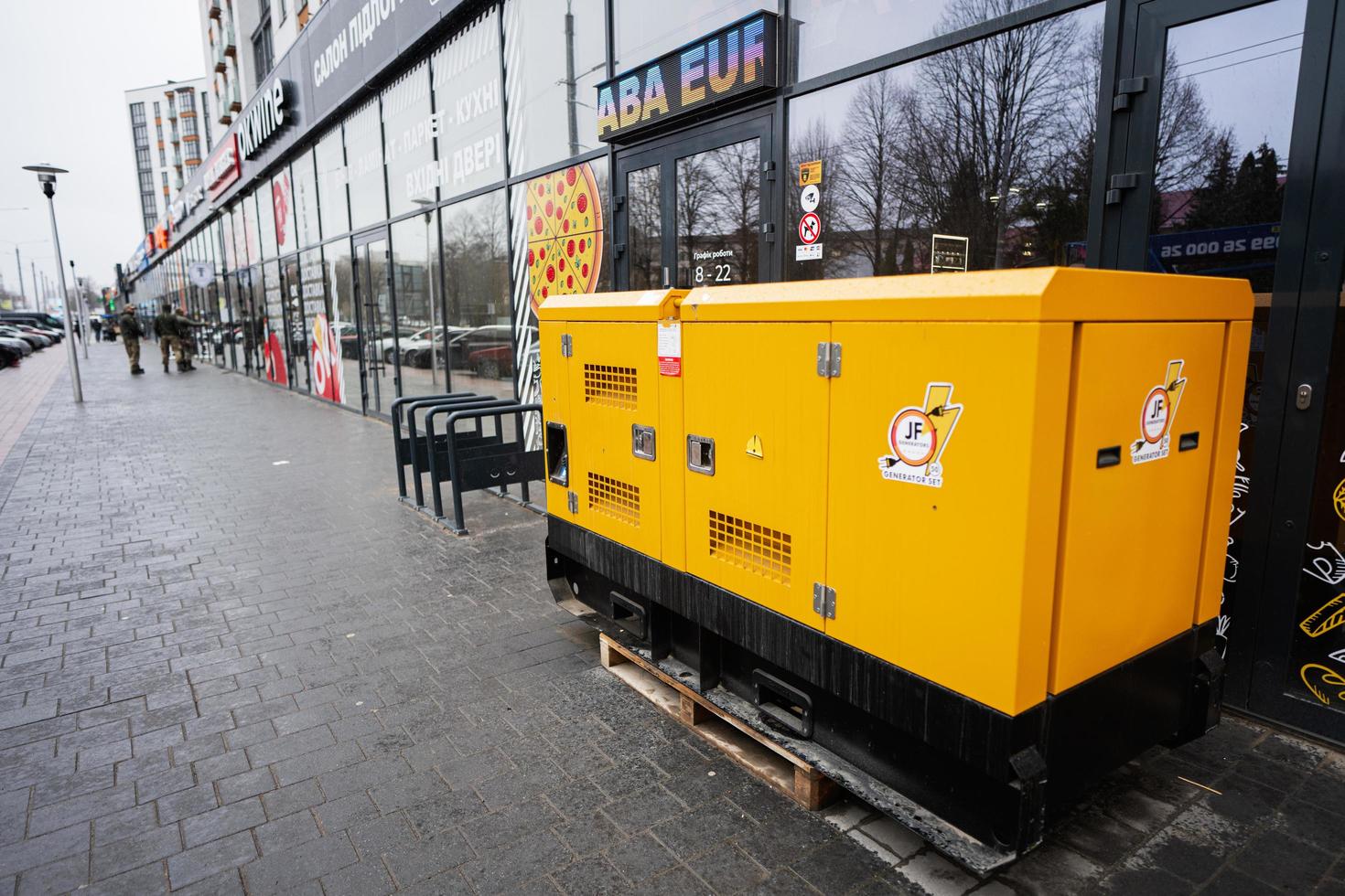 Yellow diesel generator on street. photo
