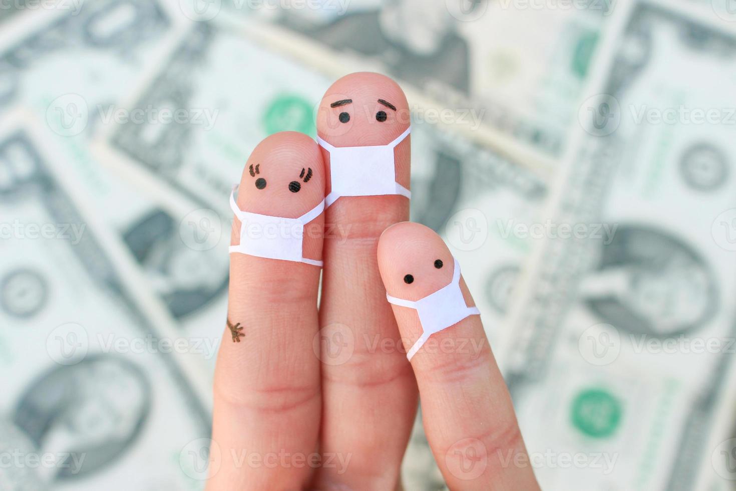 Fingers art of family with face mask on background of money. photo