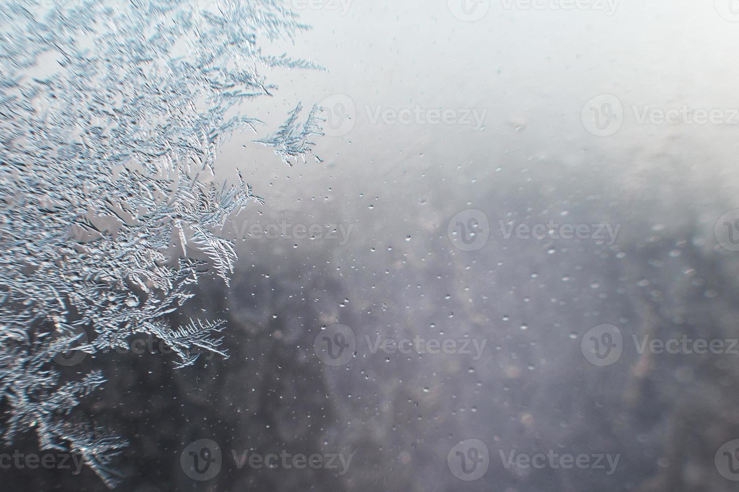 snow pattern on the glass from frost photo