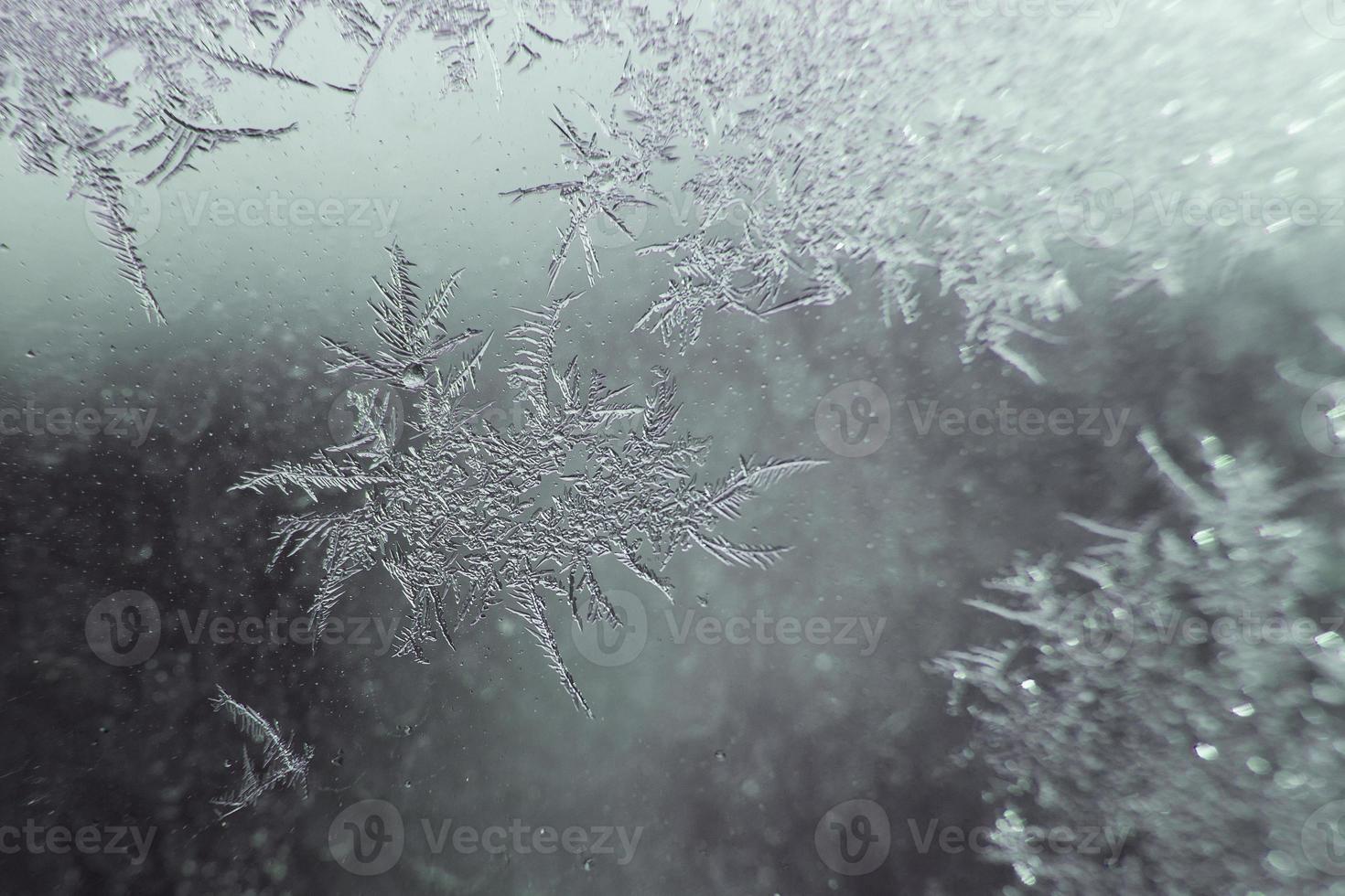 snow pattern on the glass from frost photo