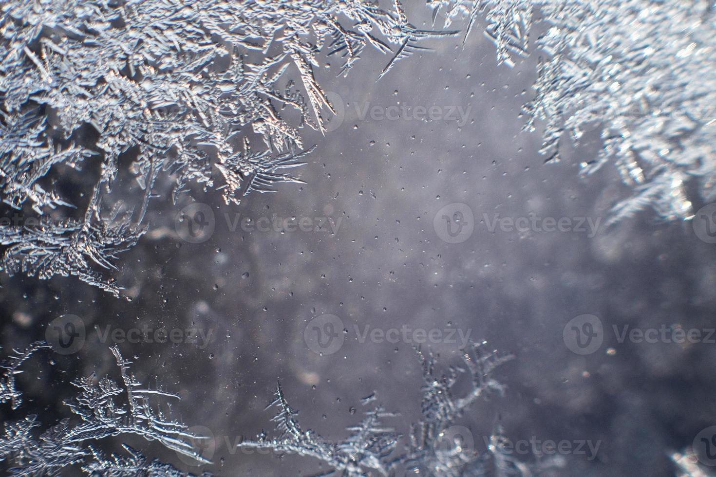 snow pattern on the glass from frost photo