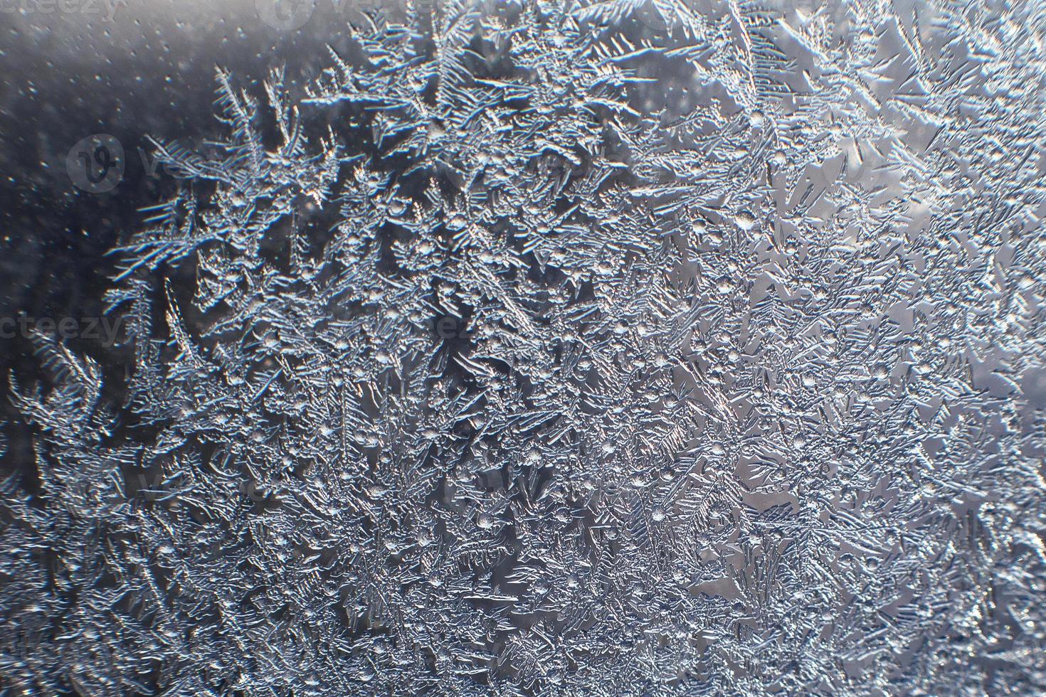 snow pattern on the glass from frost photo