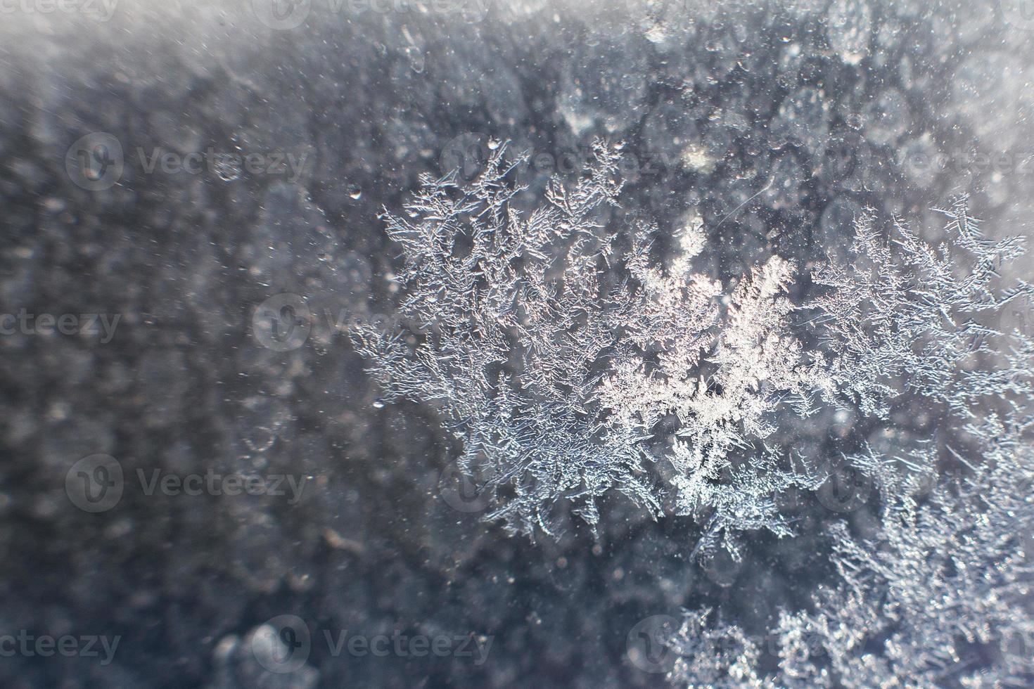 snow pattern on the glass from frost photo