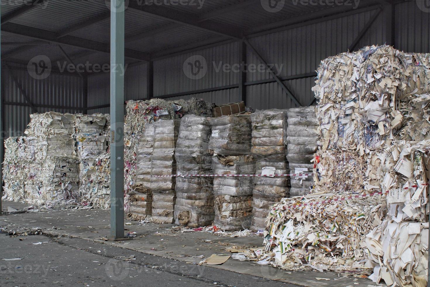 Wastepaper compact texture pile for recycling on sorting plant. Technology of reuse materials. Stack of shredded paper. Save the planet ecology concept. Industry of reduced pollution factory. Close-up photo