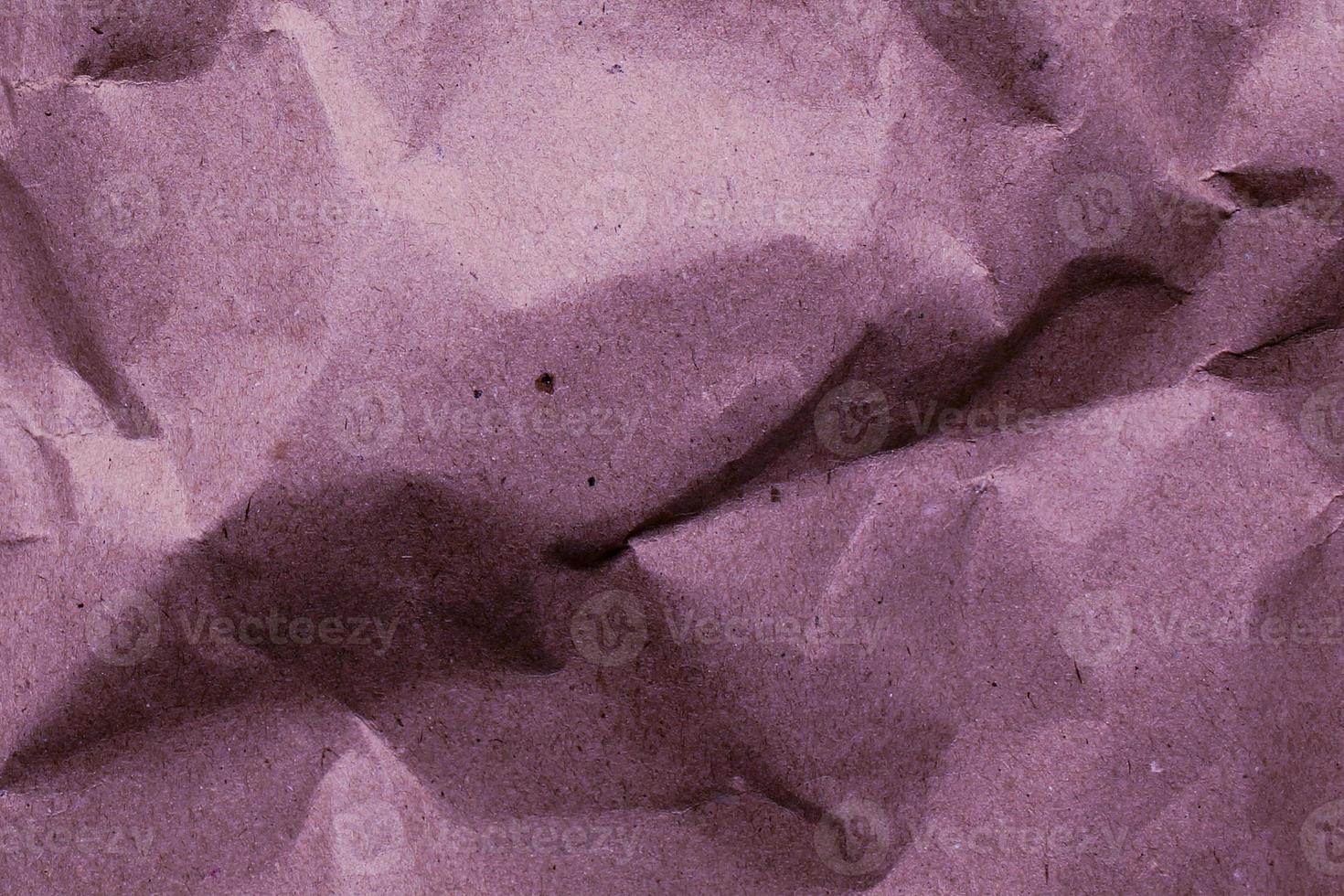 colored crumpled paper. Lilac purple background. Simple creative crumpled paper design. No text. photo
