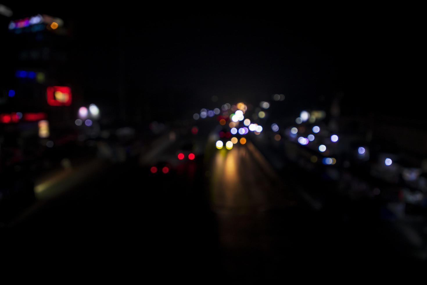 Colorful Defocus Abstract bokeh light effects on the night black background texture photo