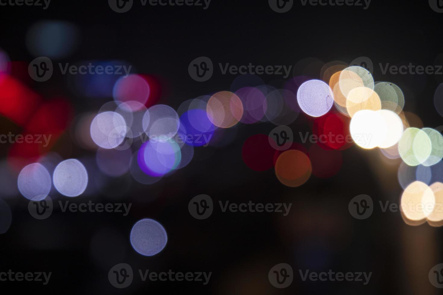 Colorful Defocus Abstract bokeh light effects on the night black background texture photo