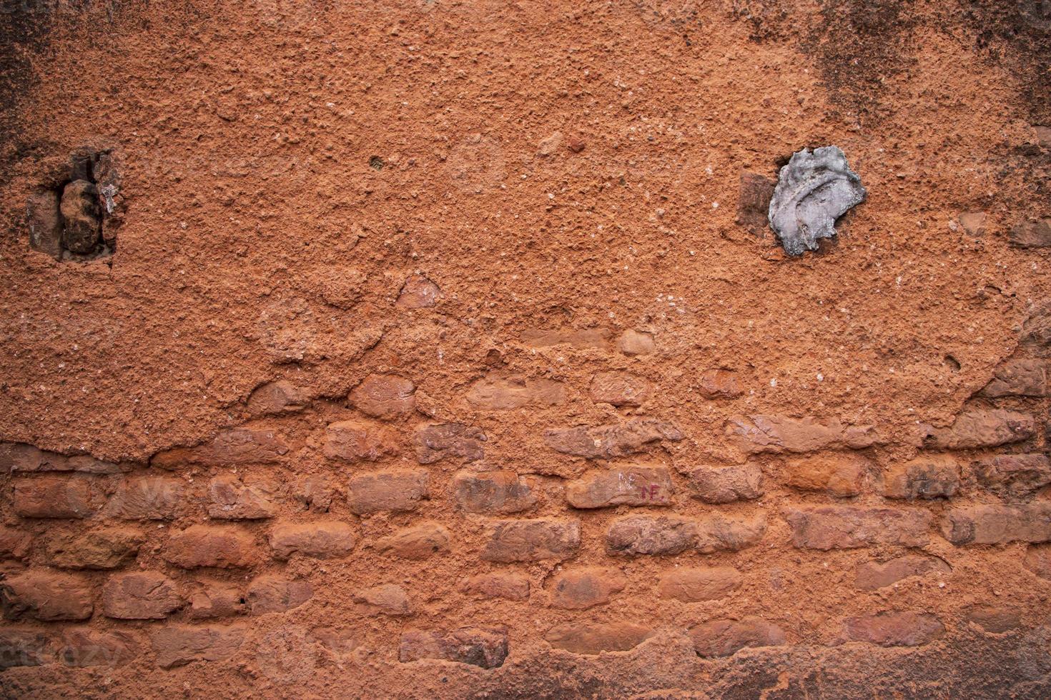 antiguo ladrillo pared rojo yeso textura lata ser usado como un antecedentes fondo de pantalla foto